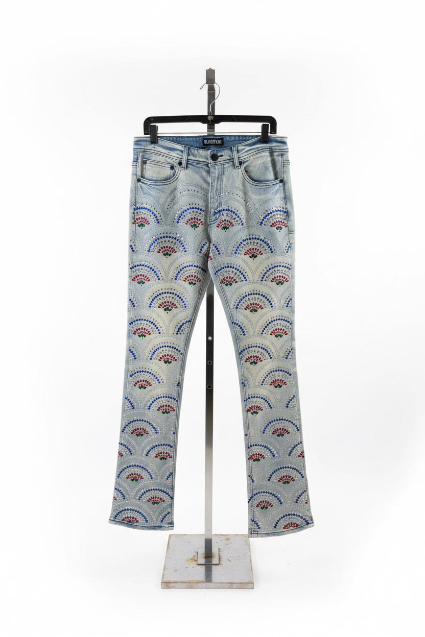 Stacked jeans with a 1000 stones on them in a fan pattern 